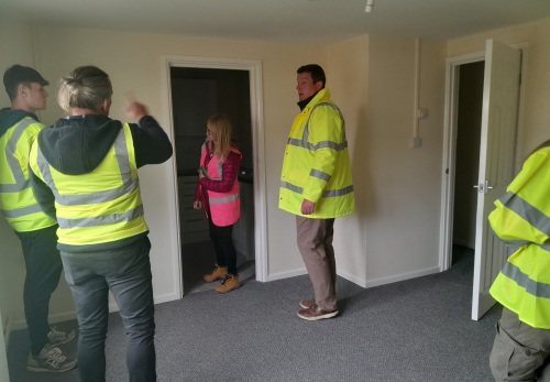 Construction students viewing a property